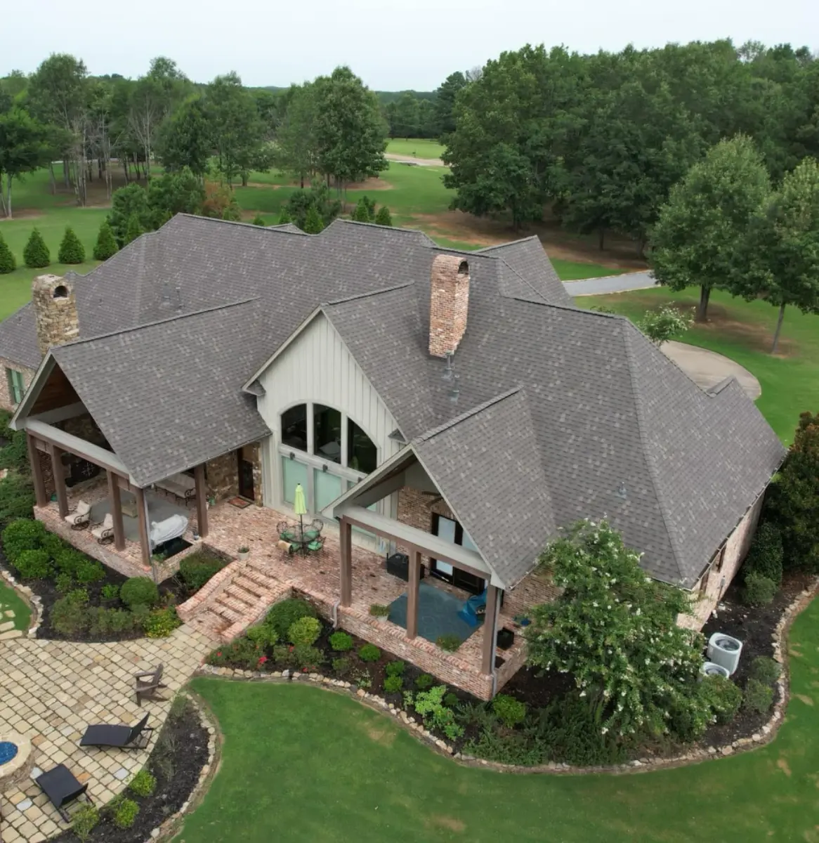 Full shot roofers working together with helmets